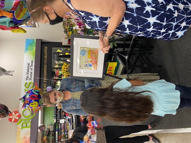 Heritage Elementary 4th grade student Itzel Soto talks with H-E-B Public Affairs Manager Julie Bedingfield while her teacher, Cheryl Kindred looks on. 