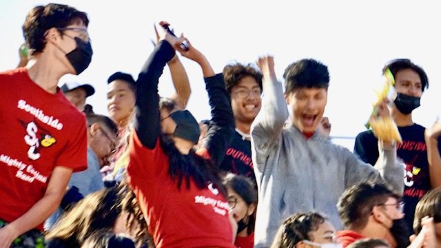 Southside Mighty Cardinal Band students react after learning they're advancing to the Area marching band competition in Cedar Park, Texas. 