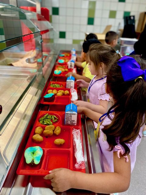 Students in the cafeteria at Menchaca Early Childhood Center. 